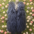 Faux Fur Shaggy Gilet on a mannequin in front of a greenery floral wall