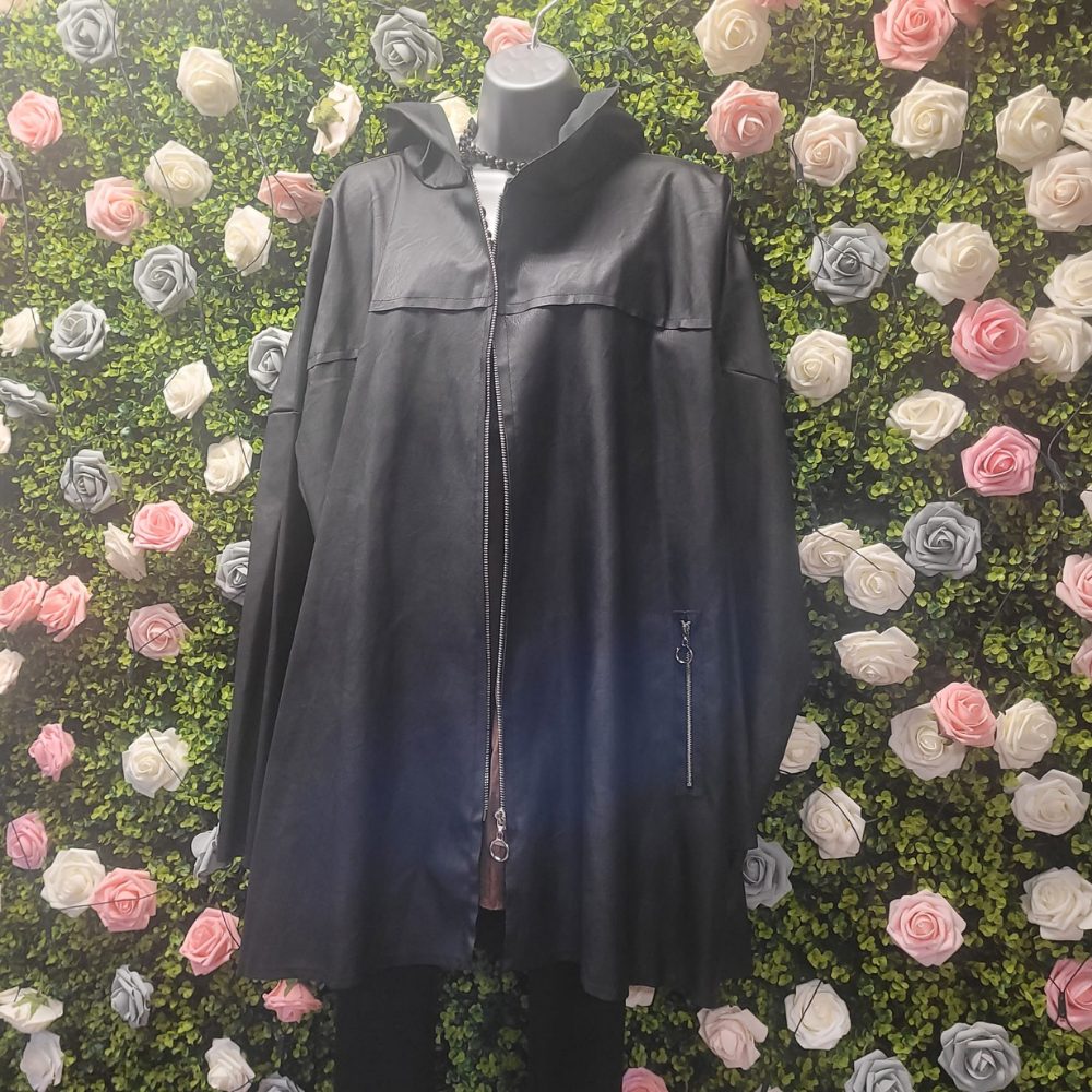Black jacket on a mannequin against a floral wall with pink, white, and gray flowers.