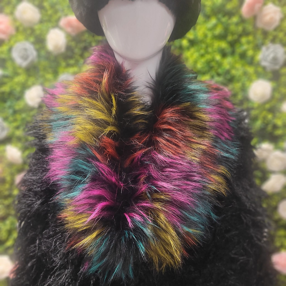 Mannequin wearing a colorful faux fur scarf with a blurred floral background