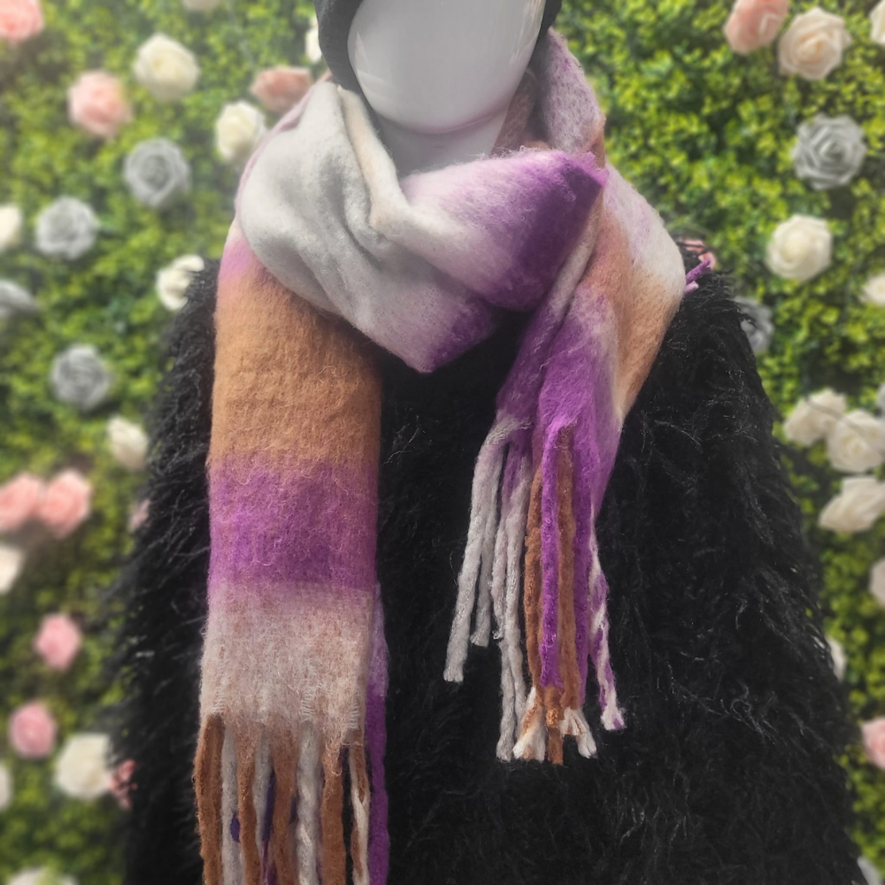 Mannequin wearing a colorful scarf with a floral background