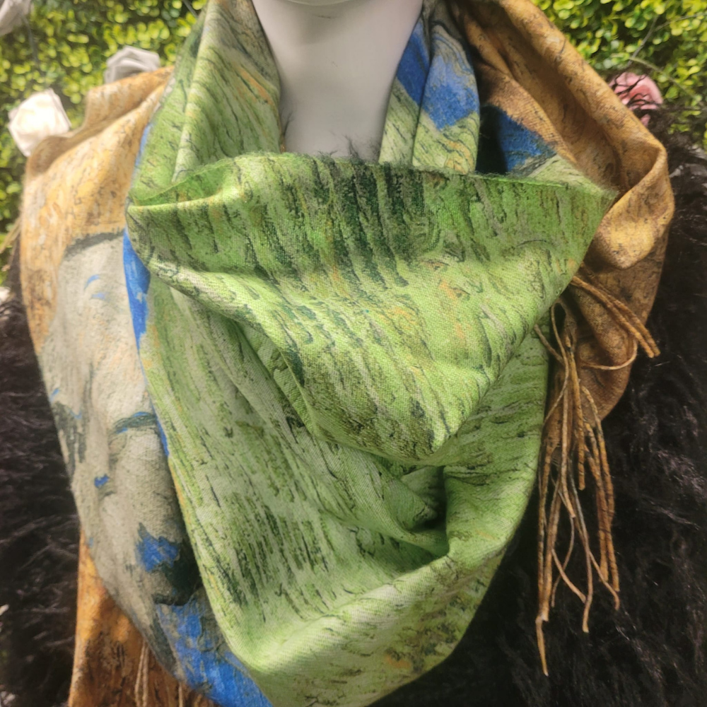 Mannequin wearing a green patterned scarf with brown and blue accents.