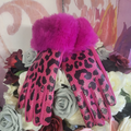 Pink leopard print gloves with purple fur cuffs on a floral background