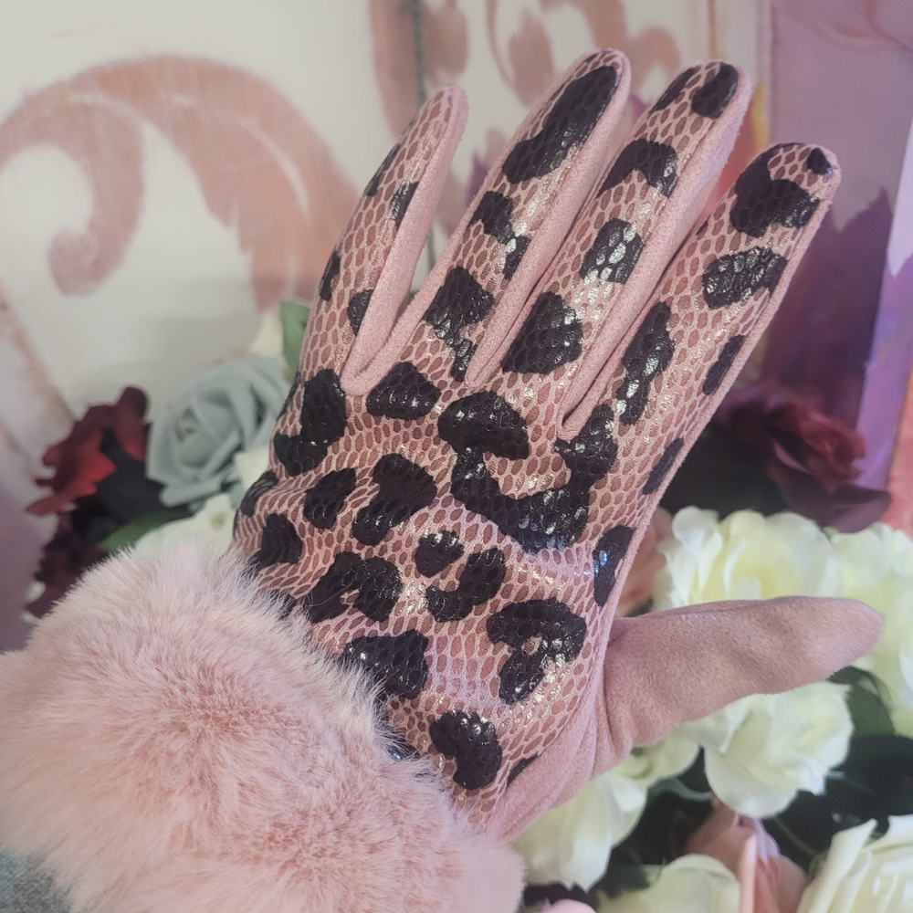 Leopard print glove with pink fur cuff on a floral background