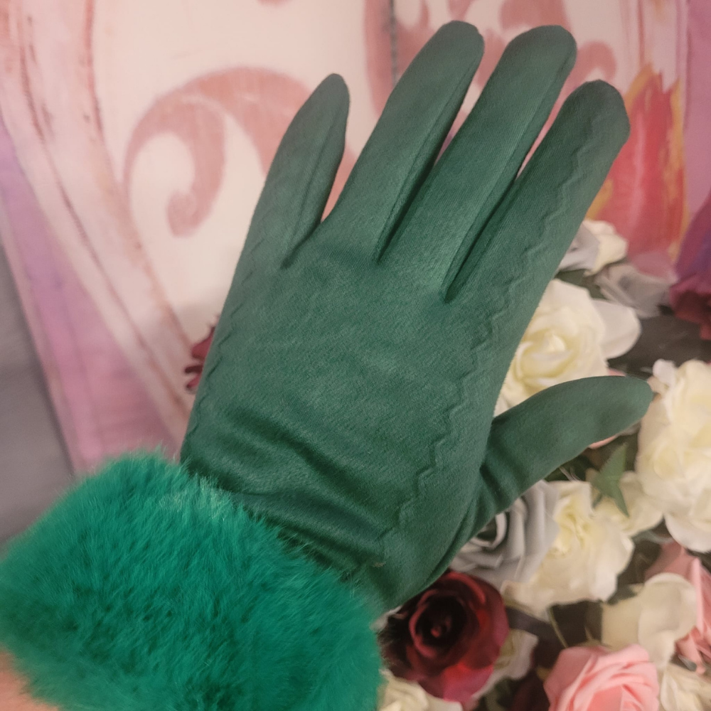 Green gloves with fur cuff against a floral background