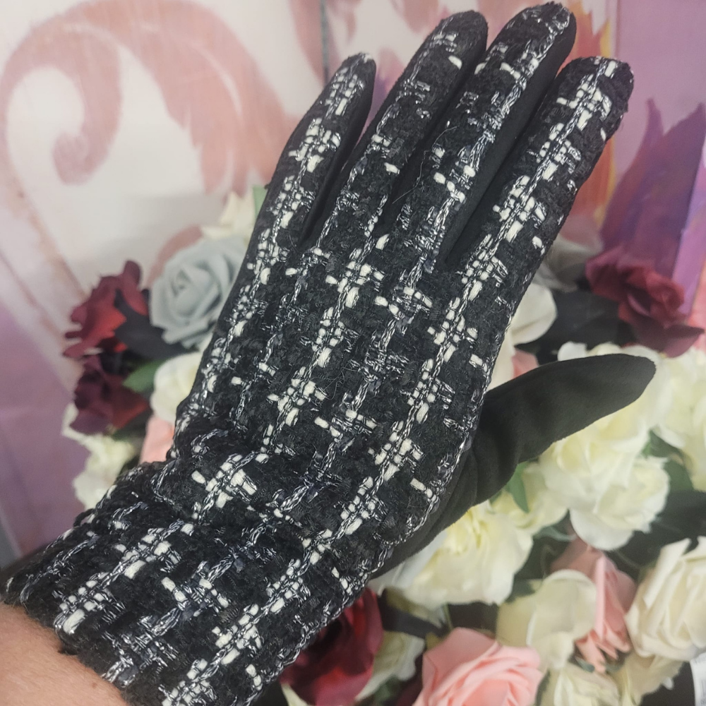 Black textured glove on a floral background