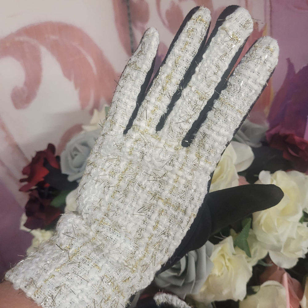 Textured glove with black accents on a floral background