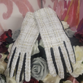 Pair of sparkling gloves on a floral background