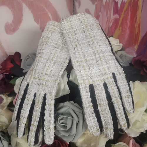 Pair of sparkling gloves on a floral background