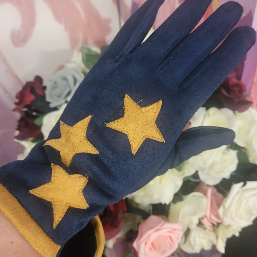 Navy blue glove with yellow stars on a floral background