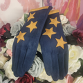 Pair of blue gloves with yellow stars on a floral background