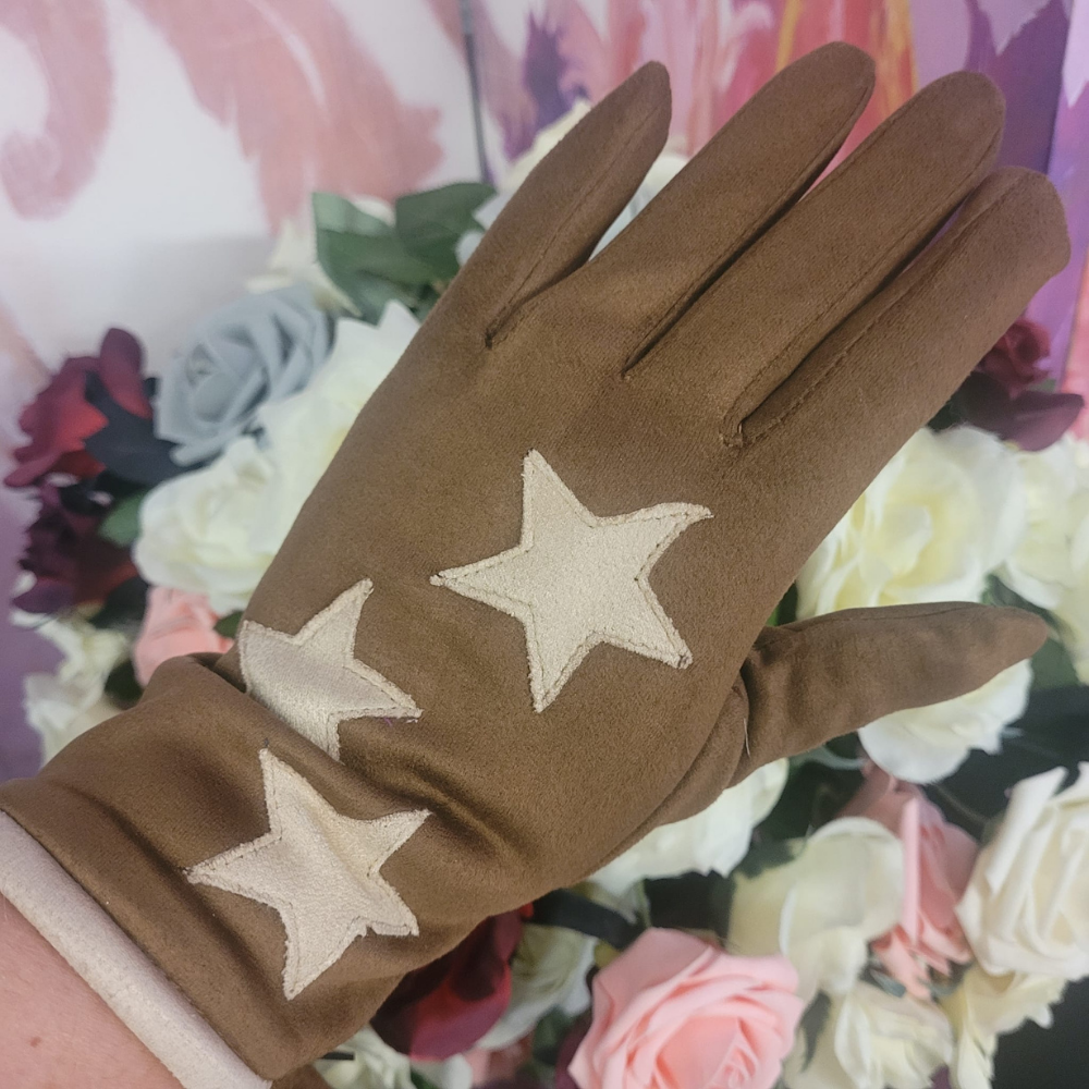 Brown glove with star patterns on a floral background