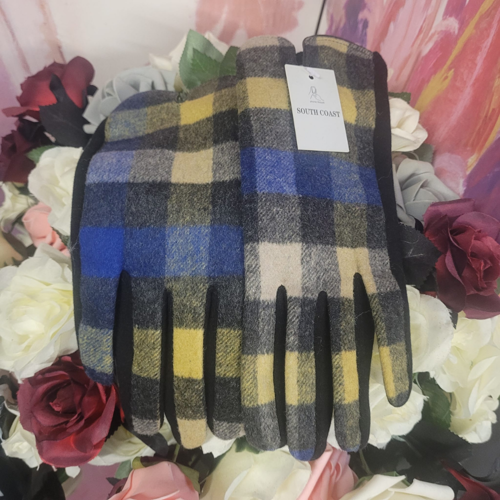 Pair of plaid gloves with a tag on a floral background