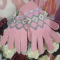 Pair of pink gloves with a diamond pattern on a floral background
