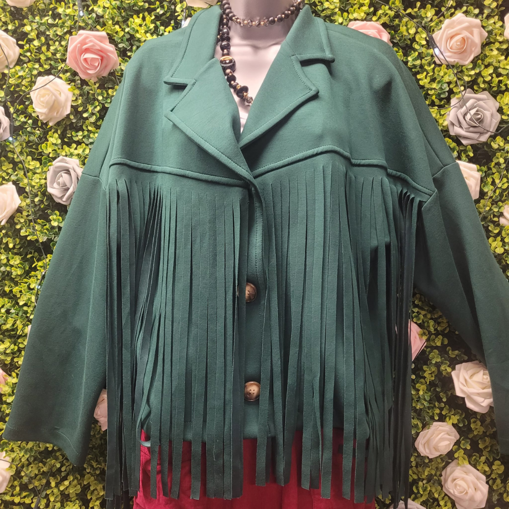 Green fringed jacket on a mannequin against a floral background