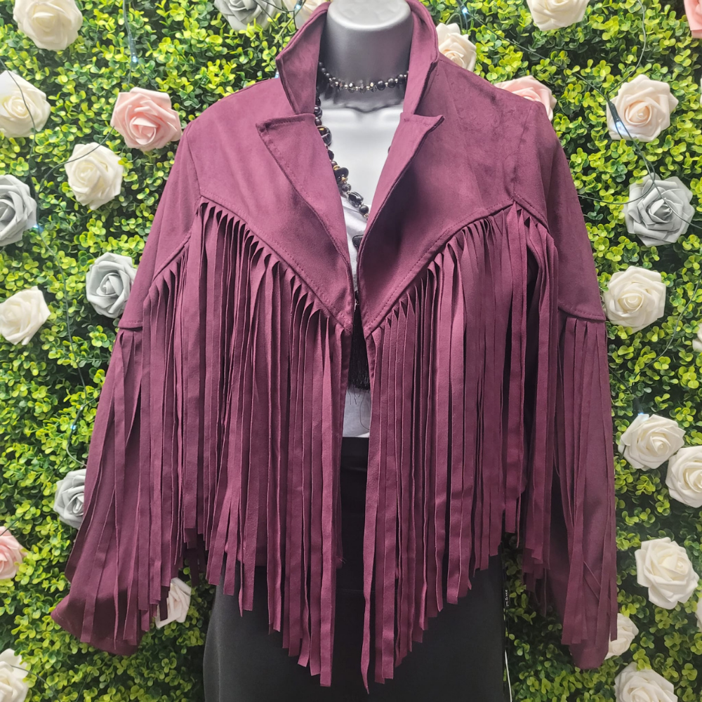 Purple fringe jacket on a mannequin against a floral background