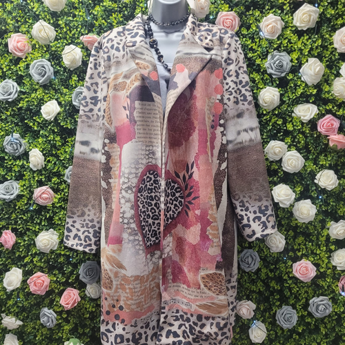 Rose coloured jacket with animal print on a greenery backdrop