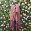 Tassel gilet in rose in a mannequin with a greenery backdrop